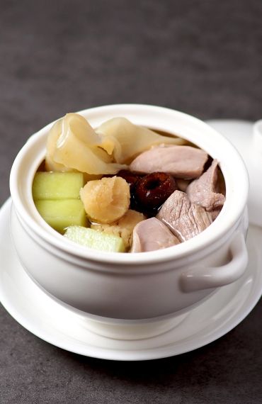 Double-boiled Fish Maw Soup with Honey Dew Melon, Sea Whelks and Conpoy